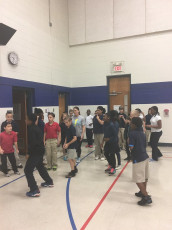 Coach Sharon at IPS #60 leading 5th and 6th graders through one of our KRAZY circuits!